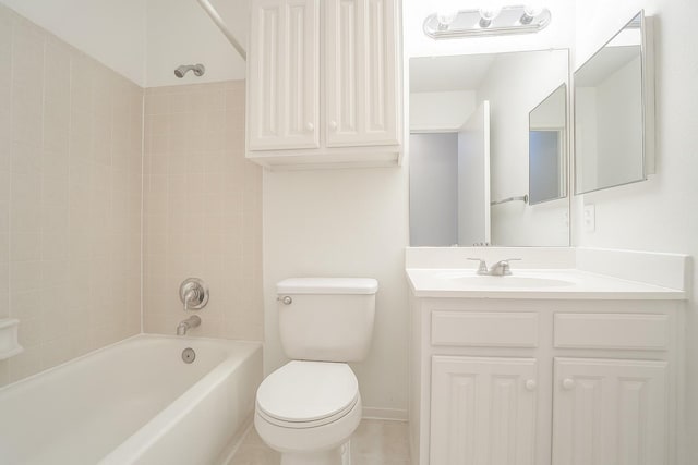 bathroom featuring toilet, bathing tub / shower combination, vanity, and tile patterned flooring