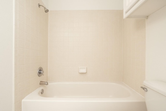 bathroom featuring toilet and shower / bath combination