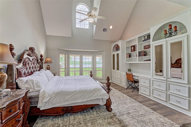 15050 Lake Paula Dr, Willis, TX 77318 - bedroom with high vaulted ceiling, dark wood-style flooring, access to exterior, and ceiling fan