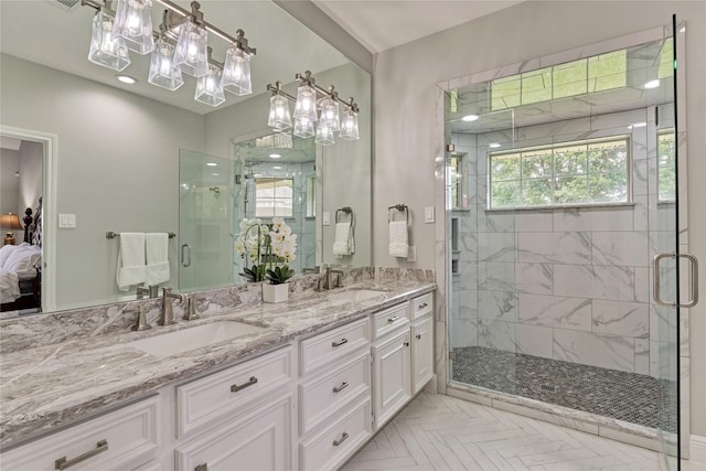 15050 Lake Paula Dr, Willis, TX 77318 - full bathroom featuring a chandelier, a shower stall, plenty of natural light, and connected bathroom