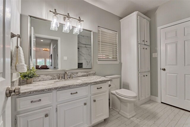 15050 Lake Paula Dr, Willis, TX 77318 - full bath featuring marble finish flooring, toilet, and vanity