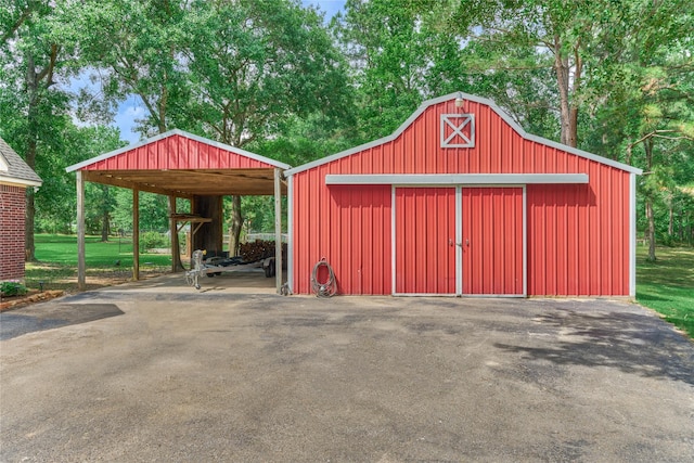 15050 Lake Paula Dr, Willis, TX 77318 - view of barn featuring a detached carport