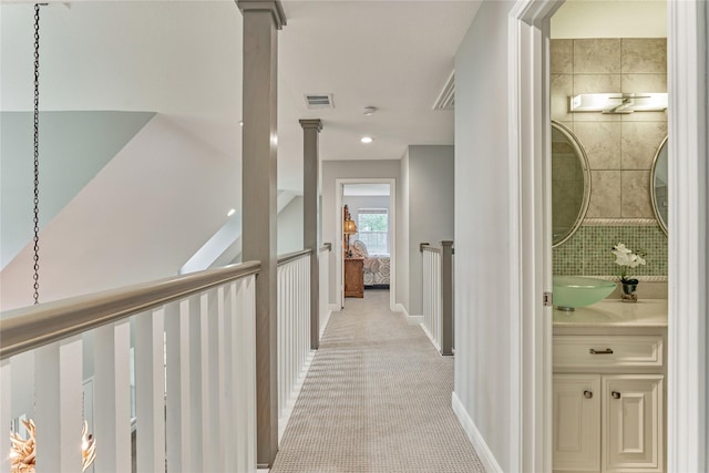15050 Lake Paula Dr, Willis, TX 77318 - corridor with light colored carpet and baseboards