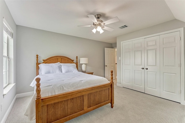 15050 Lake Paula Dr, Willis, TX 77318 - bedroom featuring light carpet, multiple windows, and baseboards