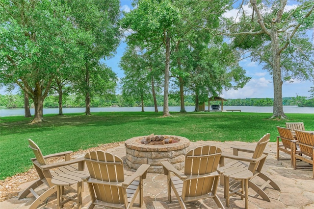 15050 Lake Paula Dr, Willis, TX 77318 - view of patio featuring a fire pit and a water view