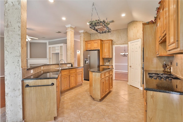 kitchen featuring a center island, light tile patterned floors, ceiling fan, a sink, and stainless steel refrigerator with ice dispenser