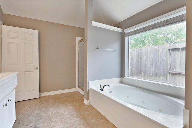 full bath featuring vanity, tile patterned floors, a stall shower, a jetted tub, and baseboards