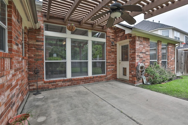 view of patio / terrace with a pergola, ceiling fan, and fence