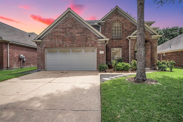 6327 Clear Canyon Dr, Katy, TX 77450 - traditional-style home with concrete driveway, a garage, brick siding, and a front lawn