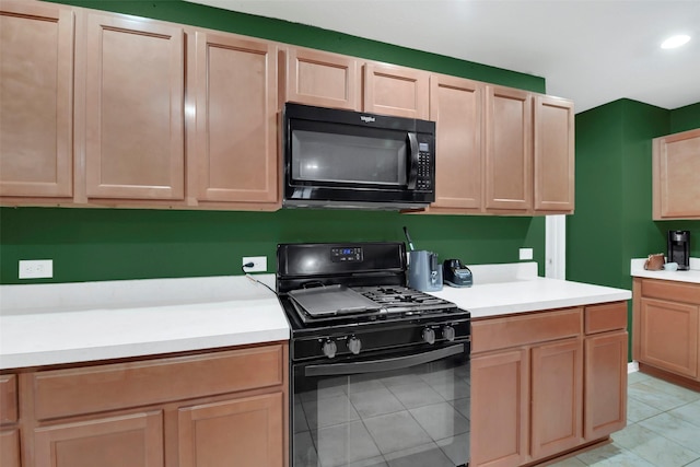 4826 Westfield Pines Dr, Katy, TX 77449 - kitchen featuring black appliances, light countertops, light tile patterned floors, and light brown cabinets