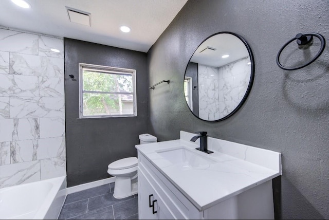bathroom featuring toilet, vanity, visible vents, tile patterned floors, and a textured wall