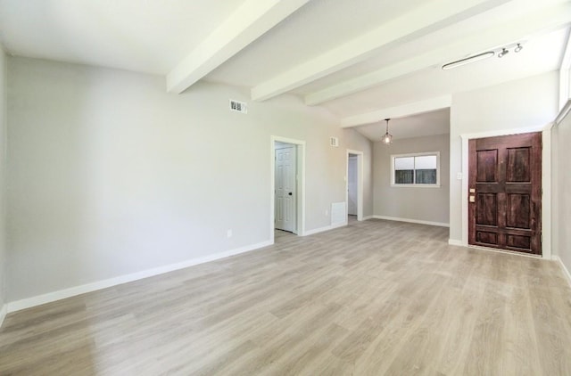 unfurnished living room with light wood-style flooring, baseboards, visible vents, and beam ceiling