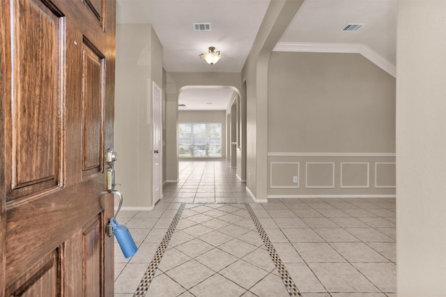 18239 Rustic Springs Dr, Tomball, TX 77375 - foyer entrance with arched walkways, baseboards, and light tile patterned floors