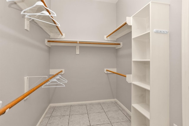 18239 Rustic Springs Dr, Tomball, TX 77375 - walk in closet featuring tile patterned flooring