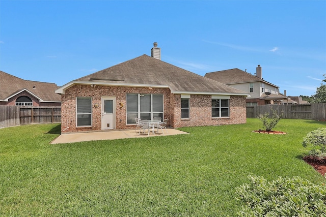 18239 Rustic Springs Dr, Tomball, TX 77375 - back of property featuring a patio area, brick siding, a shingled roof, and a chimney