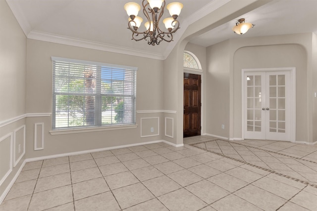 18239 Rustic Springs Dr, Tomball, TX 77375 - entryway with light tile patterned flooring, a chandelier, arched walkways, french doors, and crown molding
