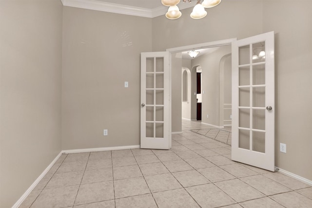 18239 Rustic Springs Dr, Tomball, TX 77375 - unfurnished room featuring french doors, arched walkways, light tile patterned floors, a chandelier, and ornamental molding