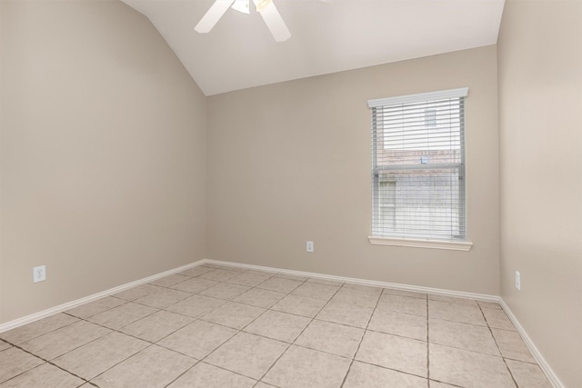 18239 Rustic Springs Dr, Tomball, TX 77375 - spare room with lofted ceiling, light tile patterned flooring, ceiling fan, and baseboards