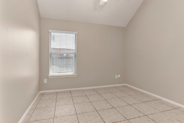 18239 Rustic Springs Dr, Tomball, TX 77375 - empty room featuring light tile patterned floors, plenty of natural light, a ceiling fan, baseboards, and lofted ceiling