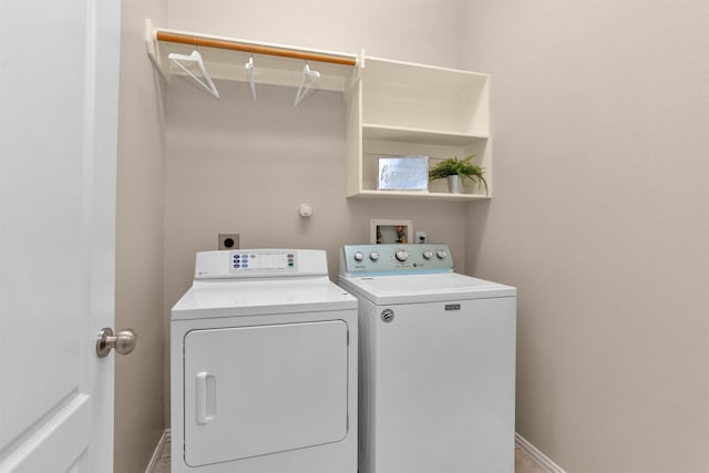 18239 Rustic Springs Dr, Tomball, TX 77375 - laundry room featuring washer and clothes dryer