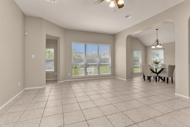 18239 Rustic Springs Dr, Tomball, TX 77375 - unfurnished room featuring arched walkways, light tile patterned floors, baseboards, a chandelier, and a ceiling fan