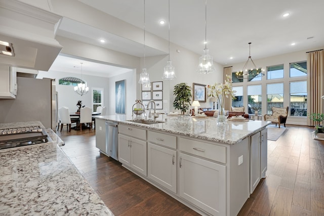 1614 Primrose Ln, Katy, TX 77493 - kitchen with a sink, a chandelier, stainless steel appliances, light stone countertops, and recessed lighting