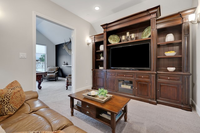 1614 Primrose Ln, Katy, TX 77493 - living area with vaulted ceiling, carpet floors, and baseboards