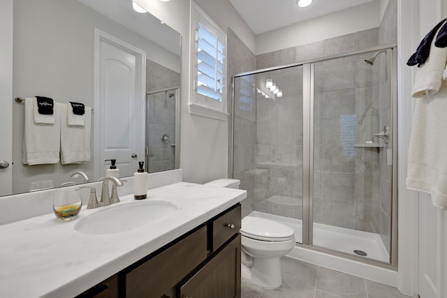 1614 Primrose Ln, Katy, TX 77493 - bathroom featuring a stall shower, tile patterned flooring, vanity, toilet, and recessed lighting