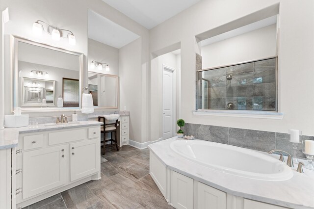 1614 Primrose Ln, Katy, TX 77493 - full bath featuring a stall shower, a bath, vanity, and baseboards