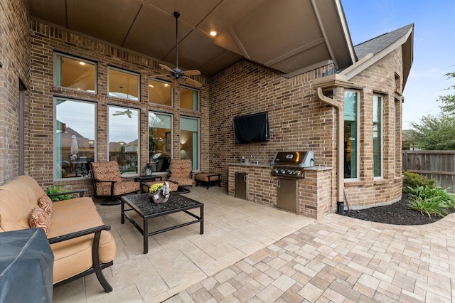 1614 Primrose Ln, Katy, TX 77493 - view of patio with exterior kitchen, ceiling fan, area for grilling, and fence
