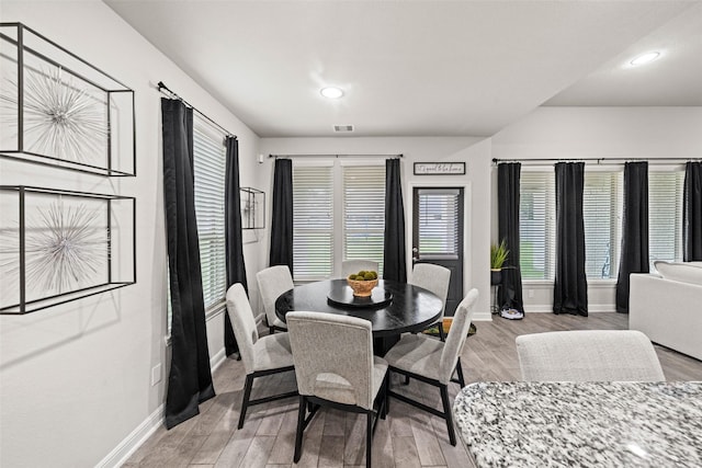 dining space with baseboards, recessed lighting, visible vents, and light wood-type flooring