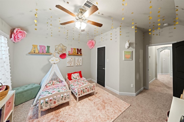 bedroom with lofted ceiling, baseboards, carpet flooring, ceiling fan, and visible vents