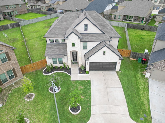 view of front of house with a shingled roof, concrete driveway, a residential view, and a garage