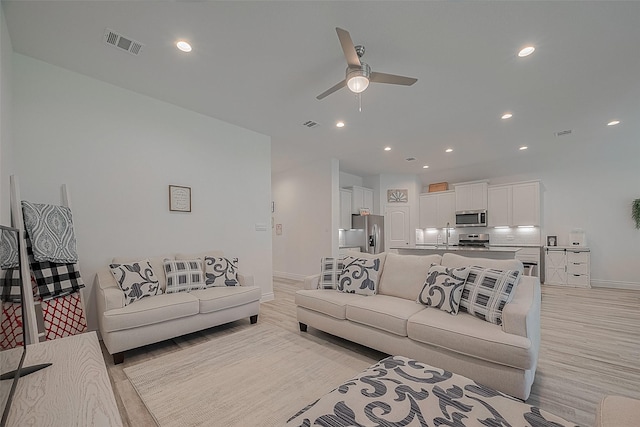 1672 Happy Valley St, Montgomery, TX 77316 - living room featuring a ceiling fan, recessed lighting, baseboards, light wood finished floors, and visible vents