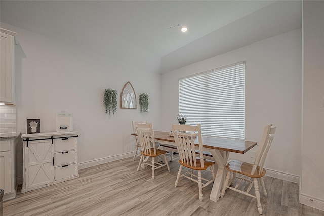 1672 Happy Valley St, Montgomery, TX 77316 - dining room with light wood finished floors, lofted ceiling, baseboards, and recessed lighting