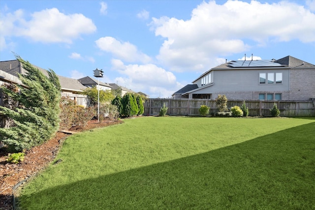 view of yard with a fenced backyard