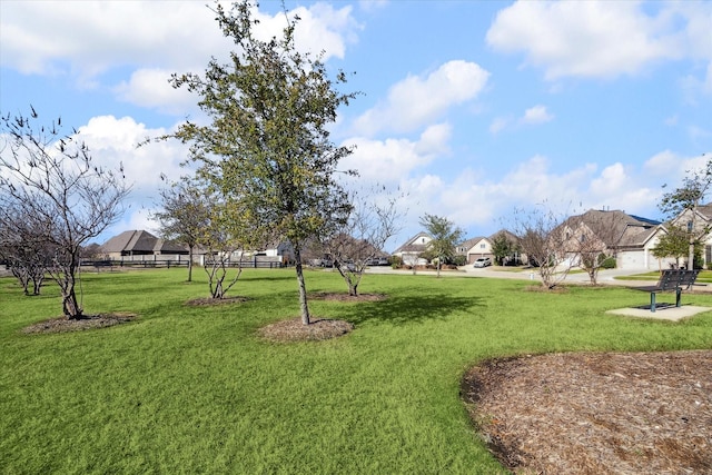 view of home's community featuring a lawn