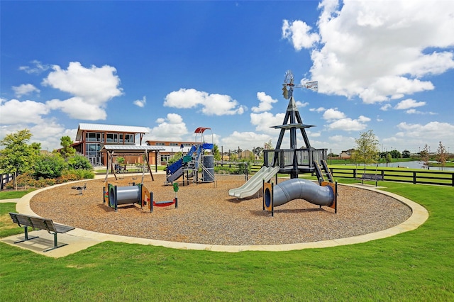 community playground with a lawn and fence