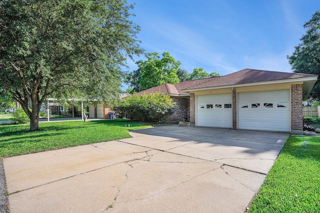 ranch-style house featuring concrete driveway, a front yard, brick siding, and an attached garage