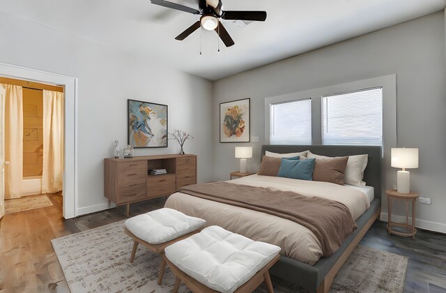 bedroom with baseboards, wood finished floors, and a ceiling fan