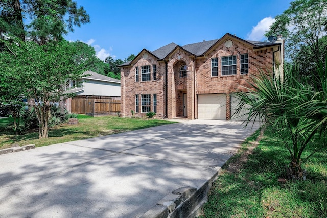 6902 Woodland Oaks, Magnolia, TX 77354 - view of front of home featuring an attached garage, fence, a chimney, brick siding, and driveway