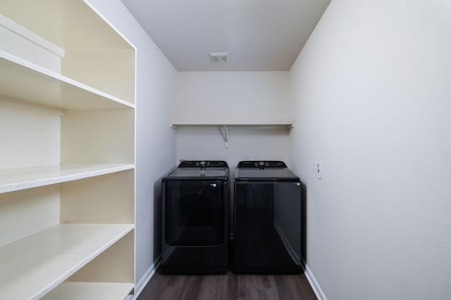 6902 Woodland Oaks, Magnolia, TX 77354 - laundry area featuring washing machine and dryer, wood finished floors, laundry area, visible vents, and baseboards