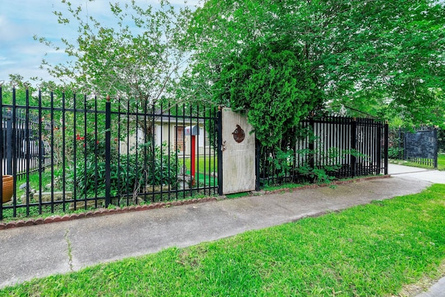 view of gate with fence