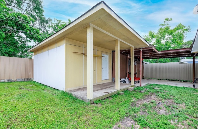 view of outdoor structure with fence