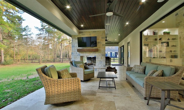 29314 Village Rdg, Magnolia, TX 77355 - view of patio with ceiling fan, an outdoor living space with a fireplace, and fence