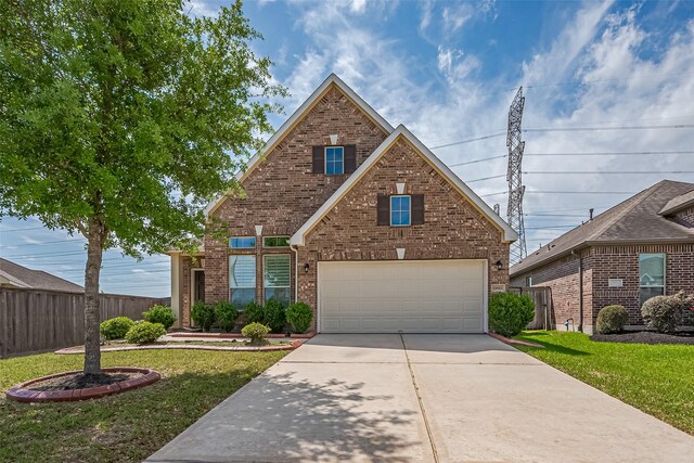 19911 Whistle Creek Ln, Cypress, TX 77433 - traditional-style home with a front lawn, brick siding, and fence