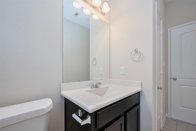 19911 Whistle Creek Ln, Cypress, TX 77433 - bathroom featuring vanity, toilet, visible vents, and tile patterned floors