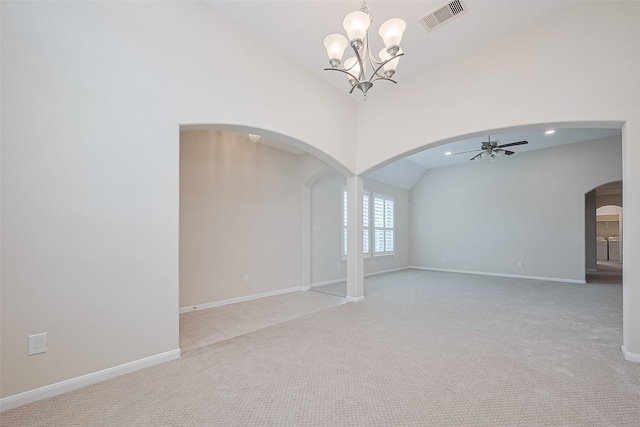 19911 Whistle Creek Ln, Cypress, TX 77433 - empty room with ceiling fan with notable chandelier, visible vents, vaulted ceiling, light carpet, and arched walkways