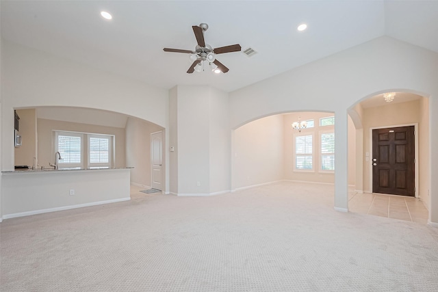 19911 Whistle Creek Ln, Cypress, TX 77433 - unfurnished living room featuring arched walkways, recessed lighting, visible vents, and light colored carpet