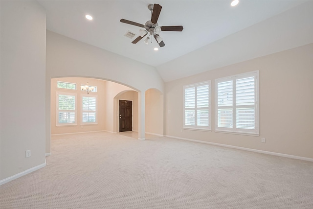 19911 Whistle Creek Ln, Cypress, TX 77433 - empty room with a healthy amount of sunlight, light colored carpet, arched walkways, and visible vents